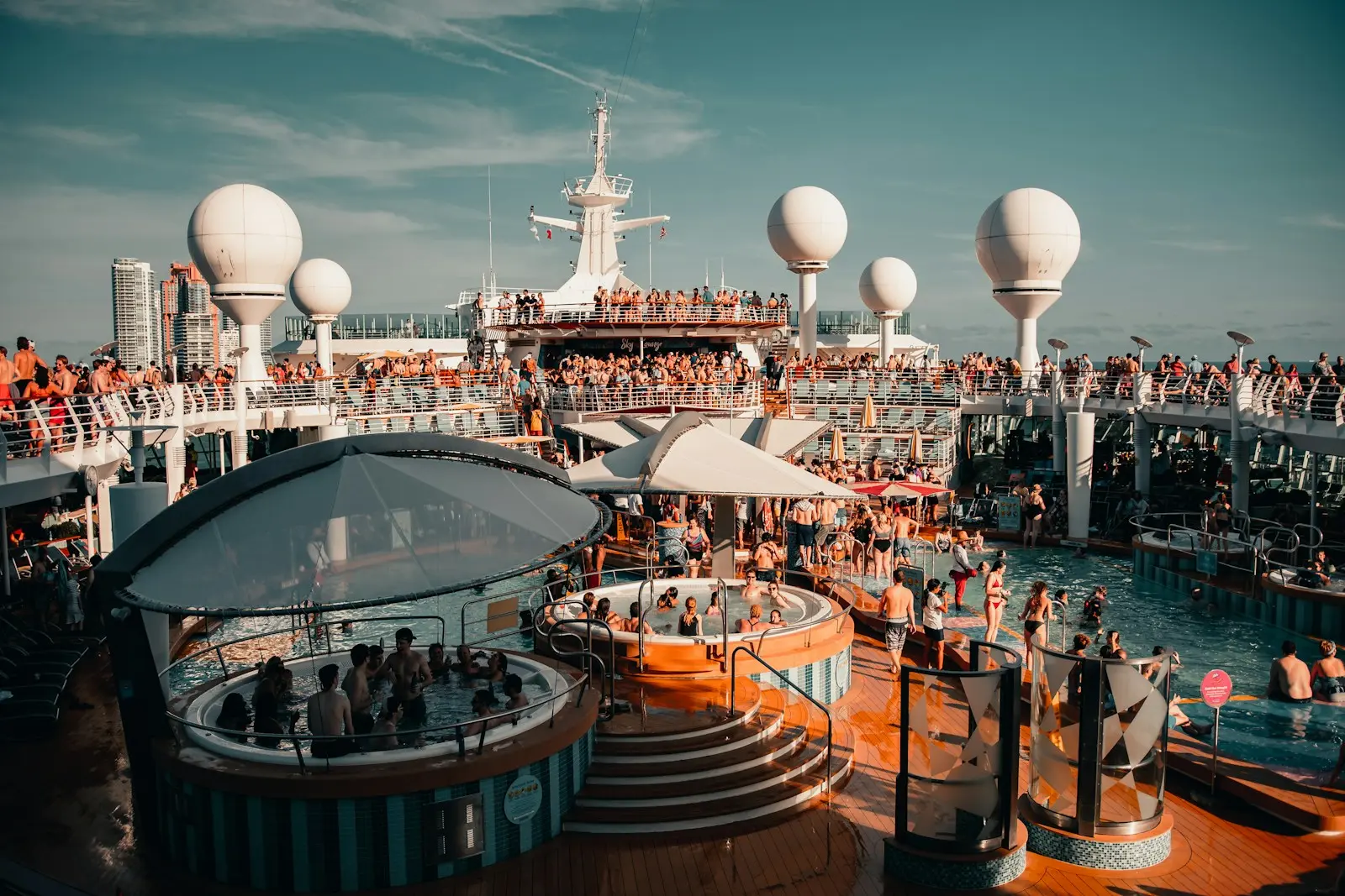 People enjoying the pool on a cruise ship