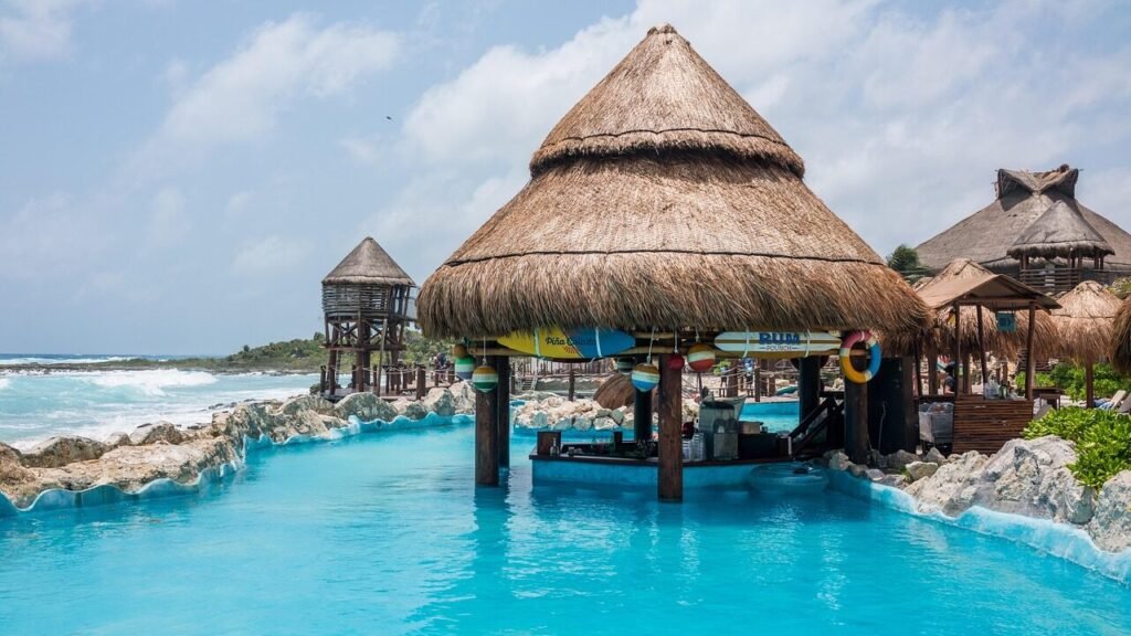 All-inclusive resort pool with swim-up bar showing vacation amenities
