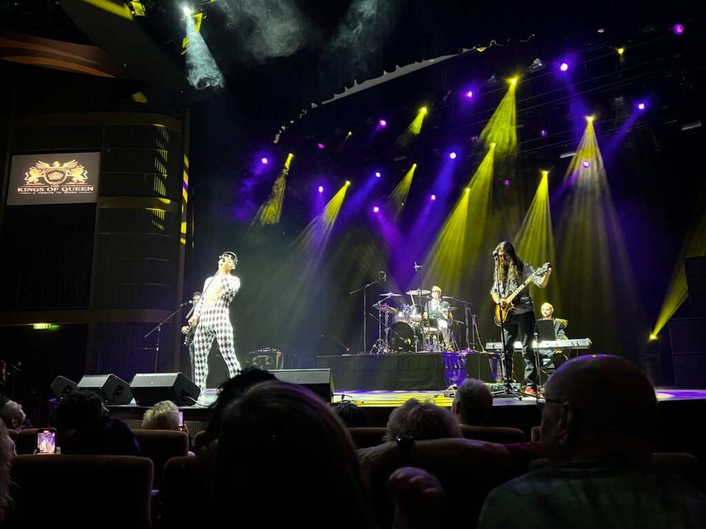 Cruise ship theater with Kings of Queen performing production show and full audience