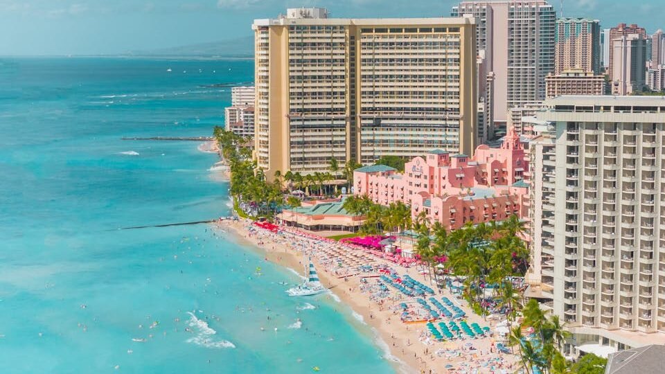 Aerial view of luxury tropical resort showing multiple pools and pristine beach for resort selection guide, how to choose a resort