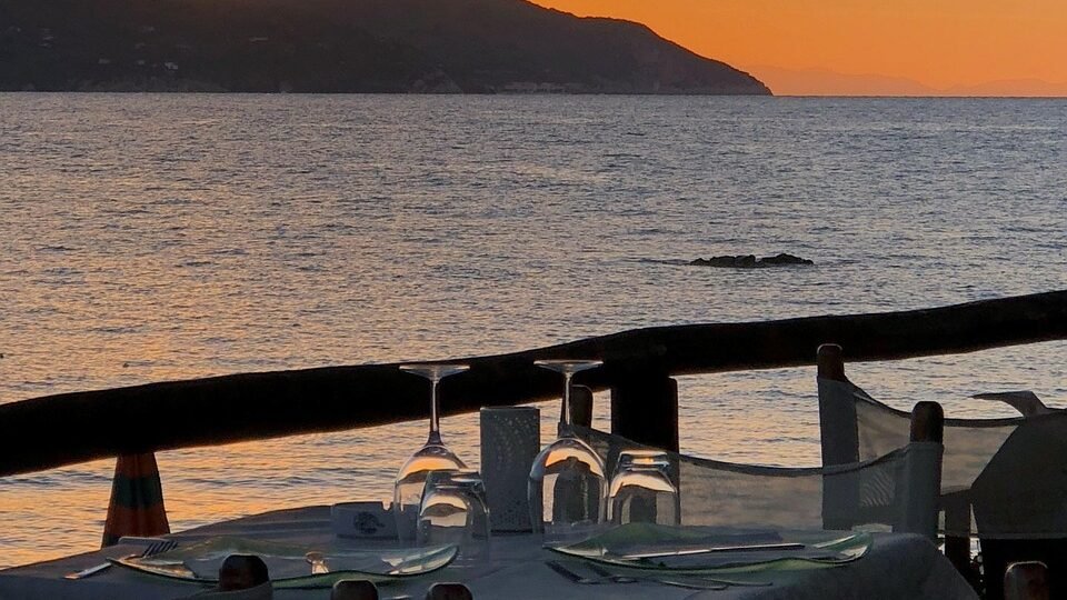 Romantic beachfront restaurant at sunset for resort dining experience